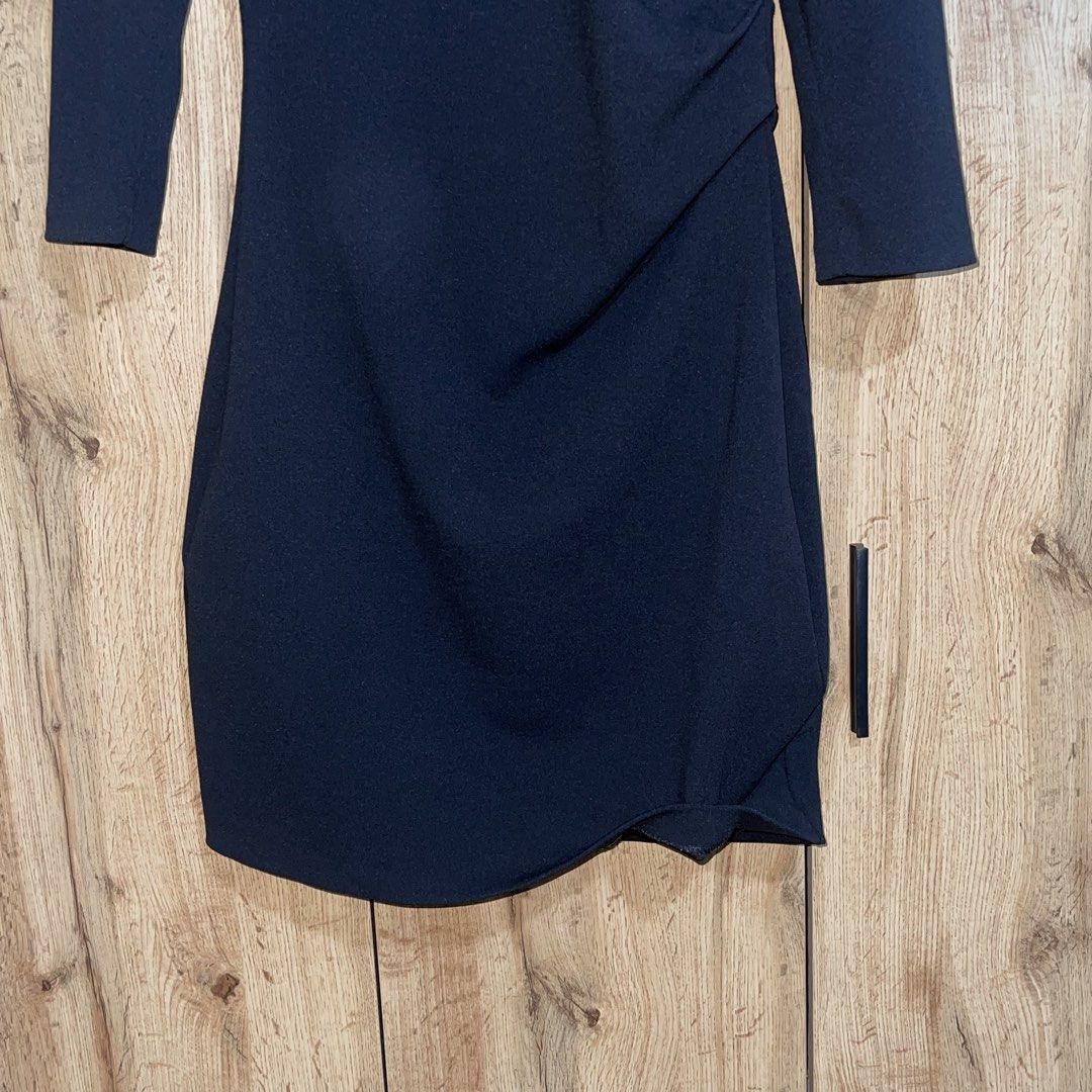 Mango Suit Collection Black V-Neck Dress (Category: Dresses) located in Manila. Submitted by cluttercleanwme (Listing ID 1467582543, Image 3). Description: Black dress from Mango Suit Collection. V-neckline with 3/4 sleeves. Asymmetric side draping detail and subtle ruching along the waistline. Back zipper closure for easy wear. Size EUR S, USA 4, MEX CH. Made in Vietnam. Clean silhouette suitable for work or evening events..