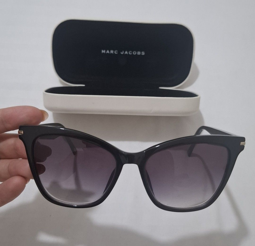Marc jacobs shades with case (Category: Sunglasses & Eyewear) located in Taguig. Submitted by welcome2myprelovedshop (Listing ID 1467459837, Image 1). Description: take this for only 800p. selling it cheap cause it has a grade (i think its #3) and the lens needs to be changes. comes with box and its clean with no scratches but the box has stains its already in sale. sooooo cute once worn and matches most face shapes..