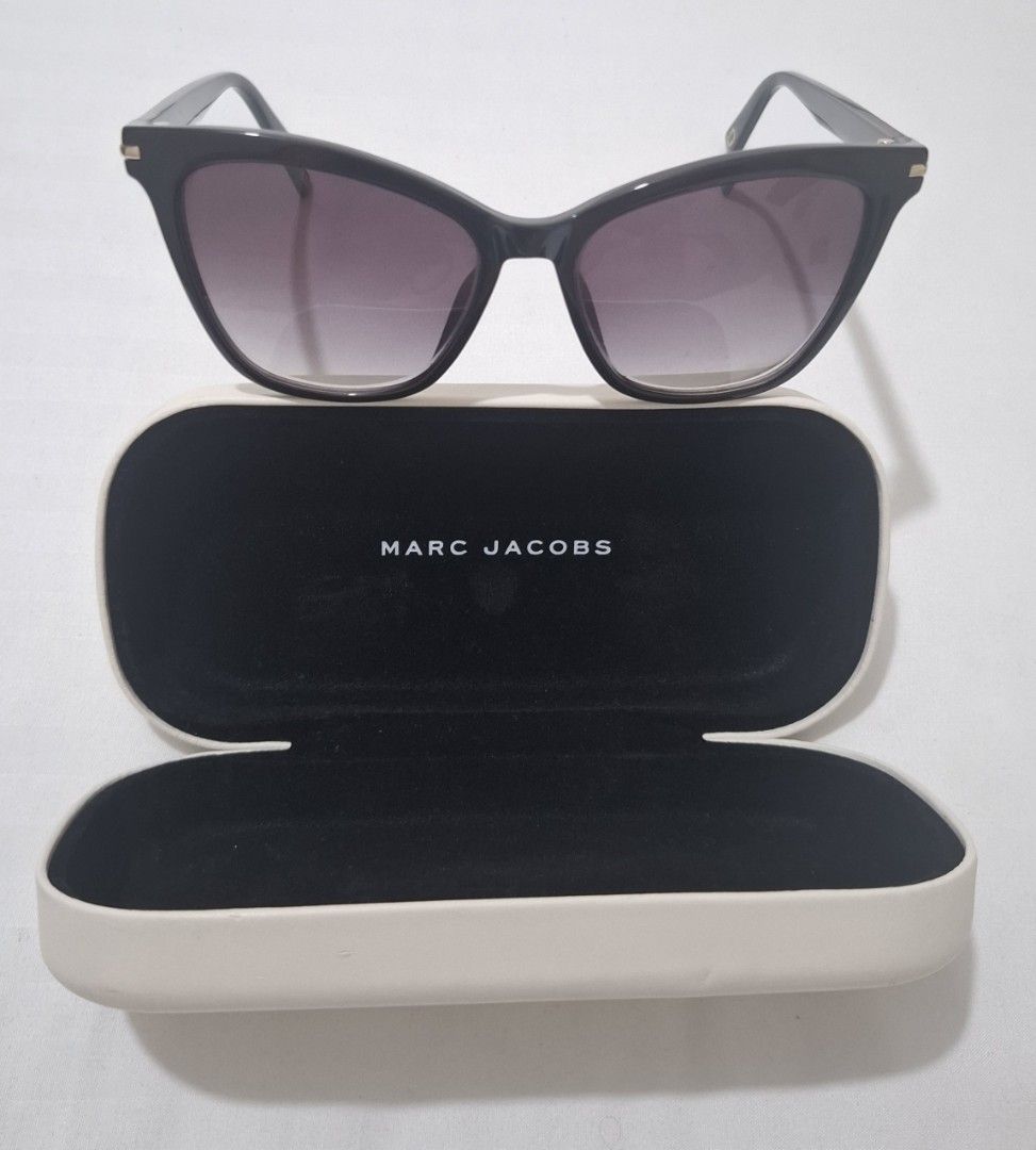Marc jacobs shades with case (Category: Sunglasses & Eyewear) located in Taguig. Submitted by welcome2myprelovedshop (Listing ID 1467459837, Image 2). Description: take this for only 800p. selling it cheap cause it has a grade (i think its #3) and the lens needs to be changes. comes with box and its clean with no scratches but the box has stains its already in sale. sooooo cute once worn and matches most face shapes..