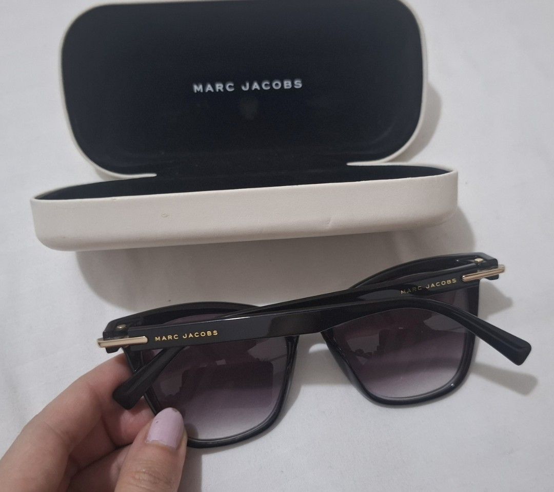 Marc jacobs shades with case (Category: Sunglasses & Eyewear) located in Taguig. Submitted by welcome2myprelovedshop (Listing ID 1467459837, Image 3). Description: take this for only 800p. selling it cheap cause it has a grade (i think its #3) and the lens needs to be changes. comes with box and its clean with no scratches but the box has stains its already in sale. sooooo cute once worn and matches most face shapes..