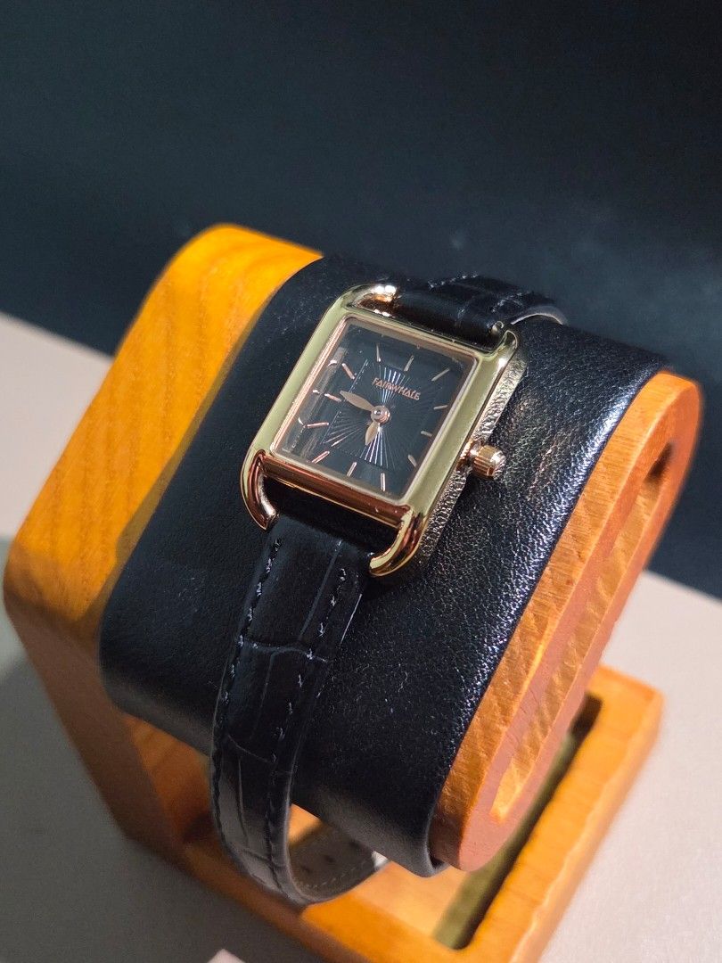 Mark Fairwhale Womens Quartz (Category: Women's Watches) located in Mabalacat. Submitted by watcherwristph (Listing ID 1467500768, Image 2). Description: Mark Fairwhale Women's Watch – Model 3570 | Black & Gold A sleek, minimalist timepiece featuring a square gold-tone case, a striking black sunray dial, and a black leather strap. A versatile design that pairs well with both casual outfits and more formal looks. Specifications: - Brand: Mark Fair