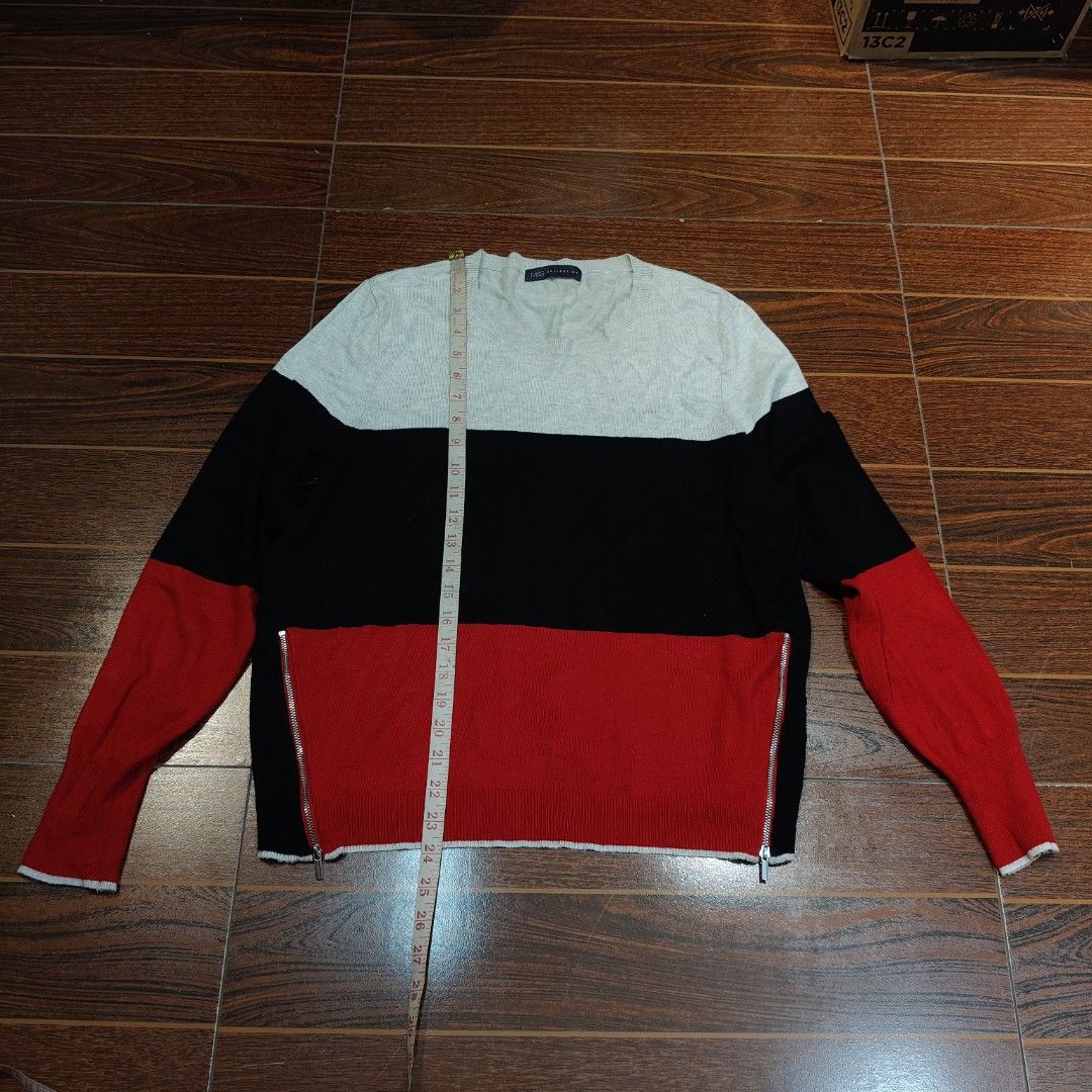 Marks & Spencer Colorblock Sweater Pullover Likenew Freesize (Category: Longsleeves) located in Bulacan. Submitted by alyssarys (Listing ID 1467502247, Image 2). Description: Marks & Spencer colorblock sweater in grey, black, and red stripes. Crew neck with long sleeves. Zippers on both sides near the hem. Made from 83% viscose and 17% polyamide. Laid flat measurements: length 23 inches, width 20 inches, armhole 8 inches. Non-stretch fabric. Comf