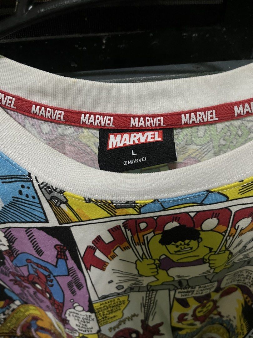 Marvel Comics All-Over Print T-Shirt Size L (Category: Tshirts & Polo Shirts ) located in Manila. Submitted by erlyn17 (Listing ID 1467479806, Image 2). Description: Marvel comic strip all-over print t-shirt. White base with colorful panels showing Spider-Man, Hulk, Thor, Captain America, and Iron Man. Marathon Sports collar tape detail inside the neckline. Size large tag attached inside collar. Short sleeves, classic crew neck fit. Graphic print