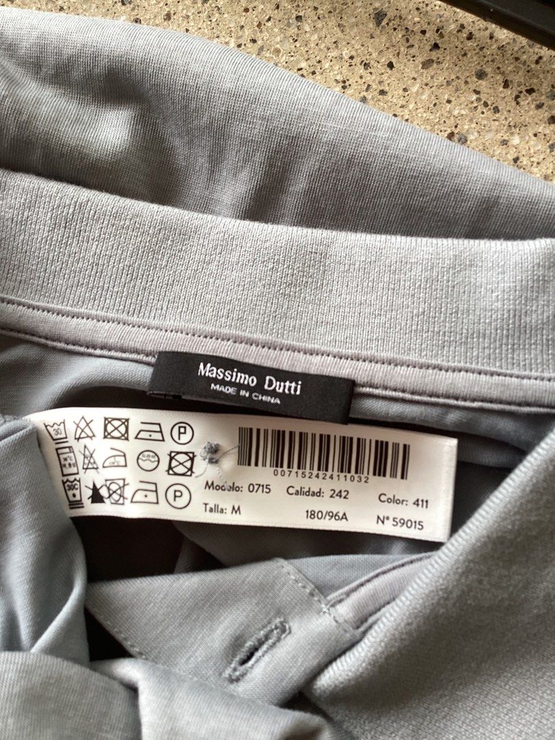 Massimo Dutti Grey Polo Shirt Size M (Category: Tshirts & Polo Shirts ) located in Bacoor. Submitted by jyano (Listing ID 1467375946, Image 3). Description: - Brand: Massimo Dutti - Color: Grey - Size: M - Design: Standard collar, single button placket, short sleeves - Origin: Made in China - Condition: Clean overall, classic and versatile for casual or smart-casual days.
