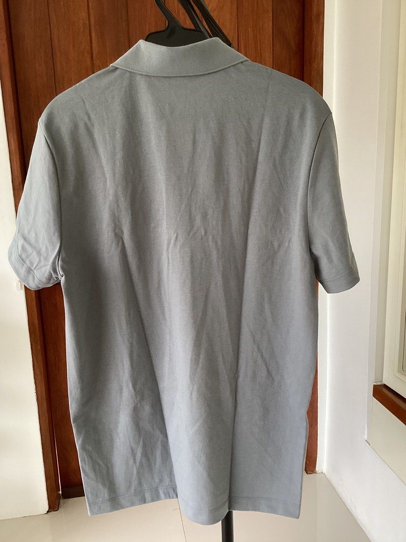 Massimo Dutti Grey Polo Shirt Size M (Category: Tshirts & Polo Shirts ) located in Bacoor. Submitted by jyano (Listing ID 1467375946, Image 2). Description: - Brand: Massimo Dutti - Color: Grey - Size: M - Design: Standard collar, single button placket, short sleeves - Origin: Made in China - Condition: Clean overall, classic and versatile for casual or smart-casual days.