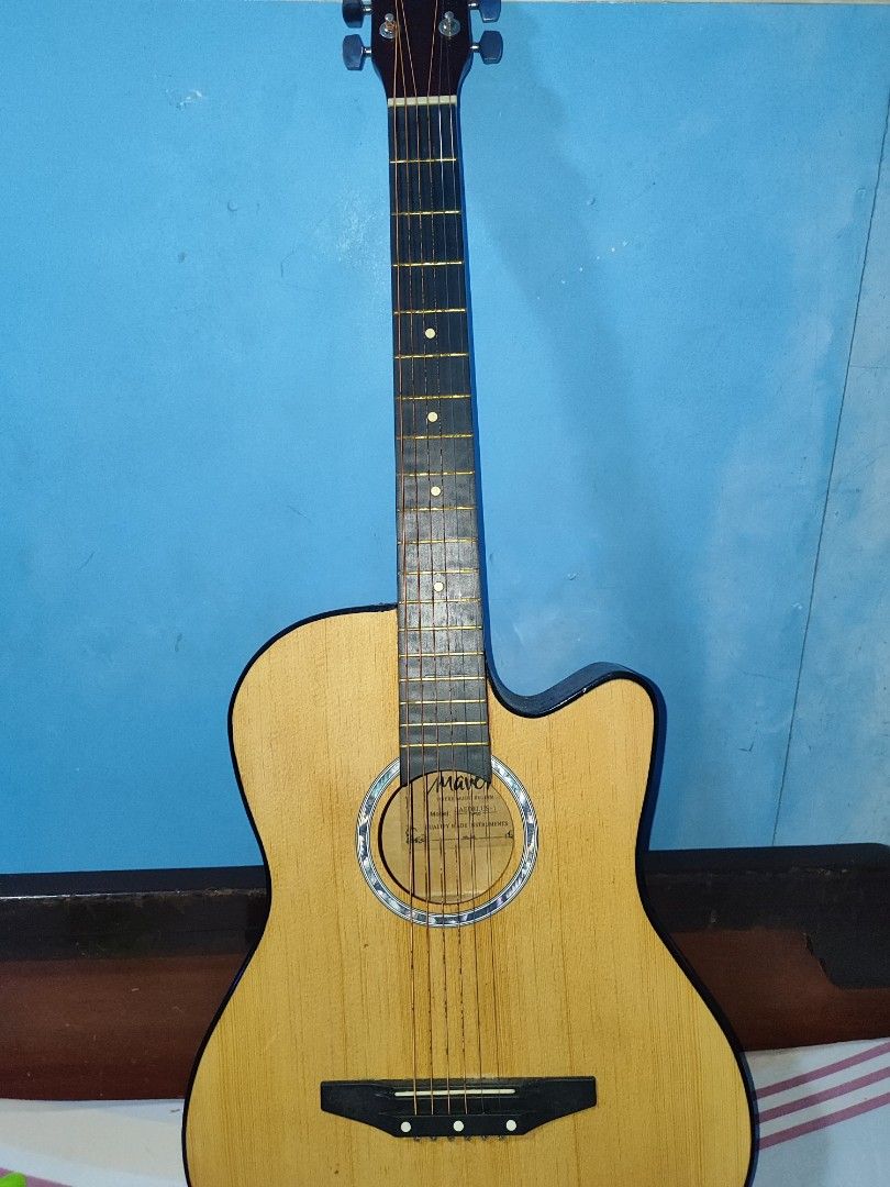 Maven Daedalus-1 Acoustic-Electric Guitar (Category: Other Audio Equipment) located in Quezon City. Submitted by sawano0324 (Listing ID 1467376152, Image 1). Description: For Sale: Maven Daedalus-1 Acoustic-Electric Guitar Price: ₱1,800 (Negotiable) Condition: ​Makinis pa ang kahoy, walang dents o basag. ​Rusty na ang strings, kailangan na lang palitan ng bagong set. ​May built-in EQ-7545R pickup pero untested ang electronics dahil walang amp sa 