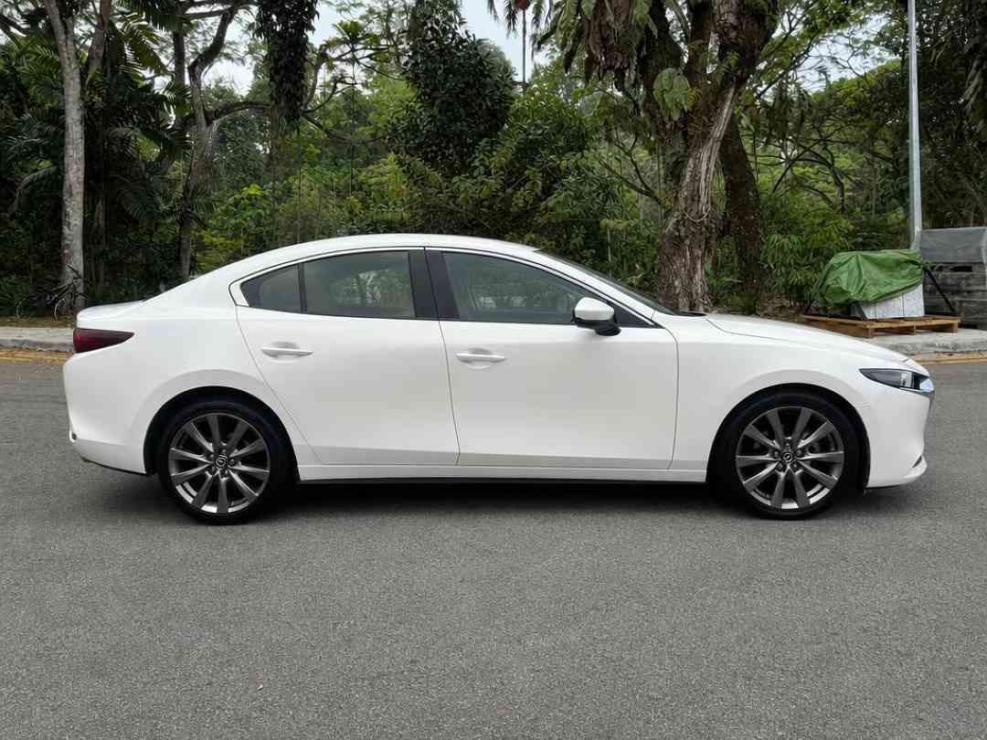 Mazda 3 Sedan Mild Hybrid 1.5 Elegance (A) (Category: Used Cars) located in Singapore. Submitted by carousell_certified_partners (Listing ID 1467531915, Image 2). Description: Pristine Condition and Well Maintained with only 1 Owner. Lowest interest rate for bank & in-house loan available. Enjoy a hassle-free 1-to-1 trade-in for a smooth upgrade experience. Contact our friendly sales advisor today for more details before it's sold. Features: 1.5l