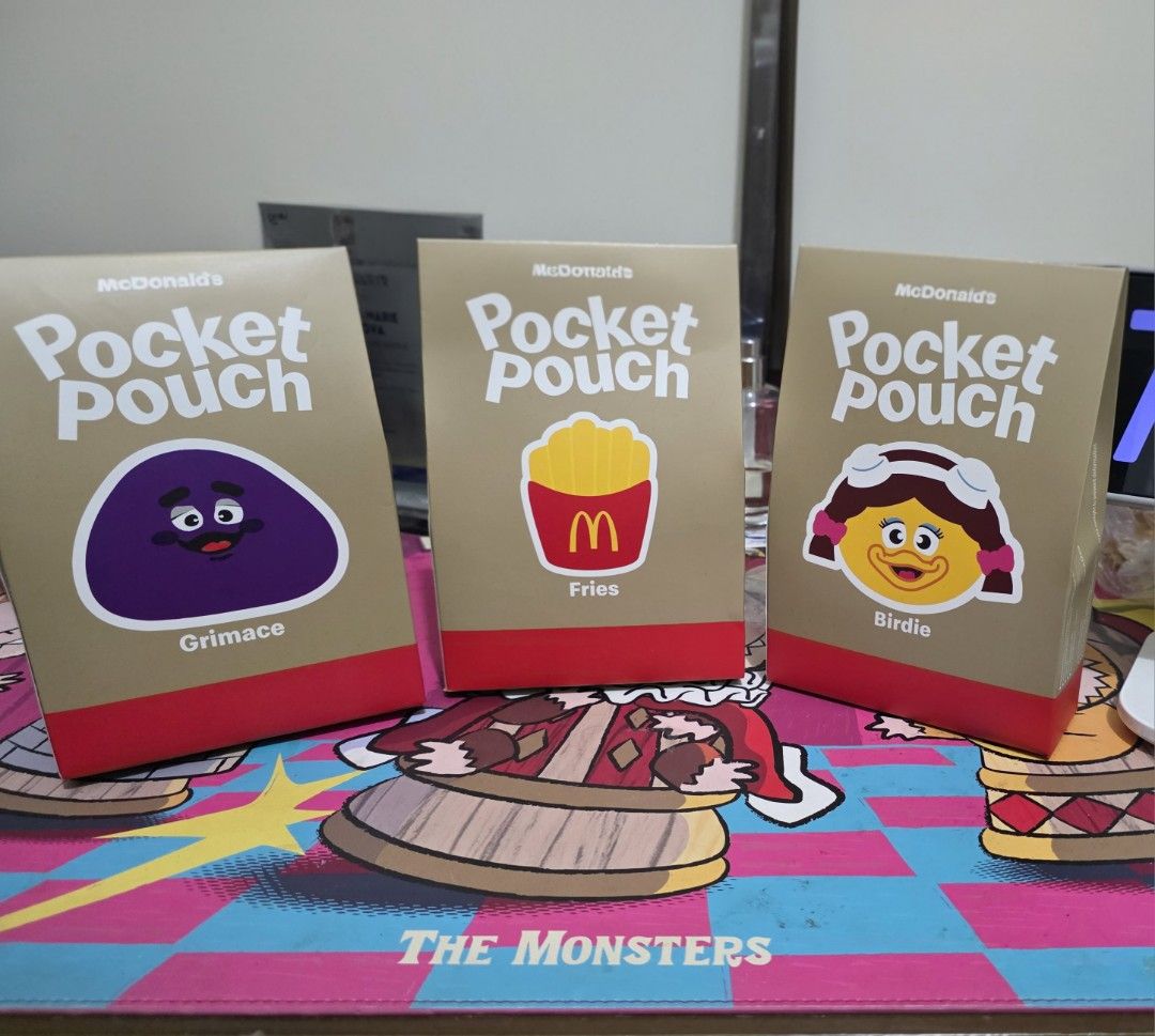McDonalds Pocket Pouch Set (Category: Character Goods) located in Pasig City. Submitted by shengshenge (Listing ID 1467464846, Image 1). Description: - Official McDonald's Pocket Pouch collection - 3 adorable designs available: Grimace, Fries, and Birdie - Fun brown paper bag style packaging with bright character graphics - Must-have collectibles for McDonald's fans and enthusiasts - Buy your favorite character or grab the whole set!.