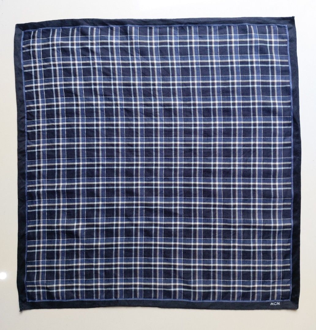 MCM Blue Plaid Pocket Square Handkerchief (Category: Handkerchief & Pocket Squares) located in Lapu Lapu. Submitted by agnesapm_29813 (Listing ID 1467503289, Image 2). Description: - Brand: MCM - Color/Pattern: Navy blue with white and blue classic tartan plaid - Size: Approximately 18 x 18 inches - Details: Soft fabric, clean finished edges, and embroidered white MCM logo branding - Washed and ironed already .
