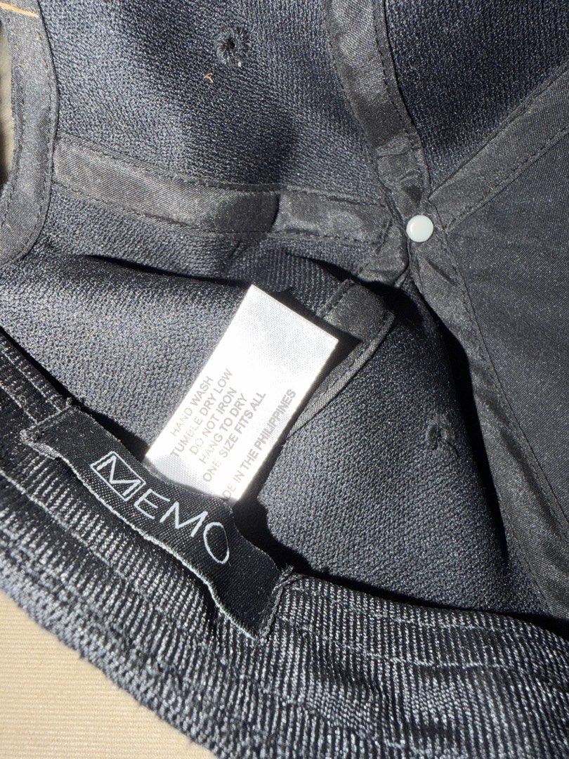 MEMO Plaid Baseball Cap One Size Fits All (Category: Caps & Hats) located in Manila. Submitted by janjewel072979 (Listing ID 1467529743, Image 2). Description: - Brand: MEMO - Design: Black and gray plaid with white embroidered lettering - Size: One size fits all with adjustable inner strap - Origin: Made in the Philippines - Care: Hand wash, hang to dry - Condition: Clean fabric construction ! Have 2 stocks ! Negotiable price.