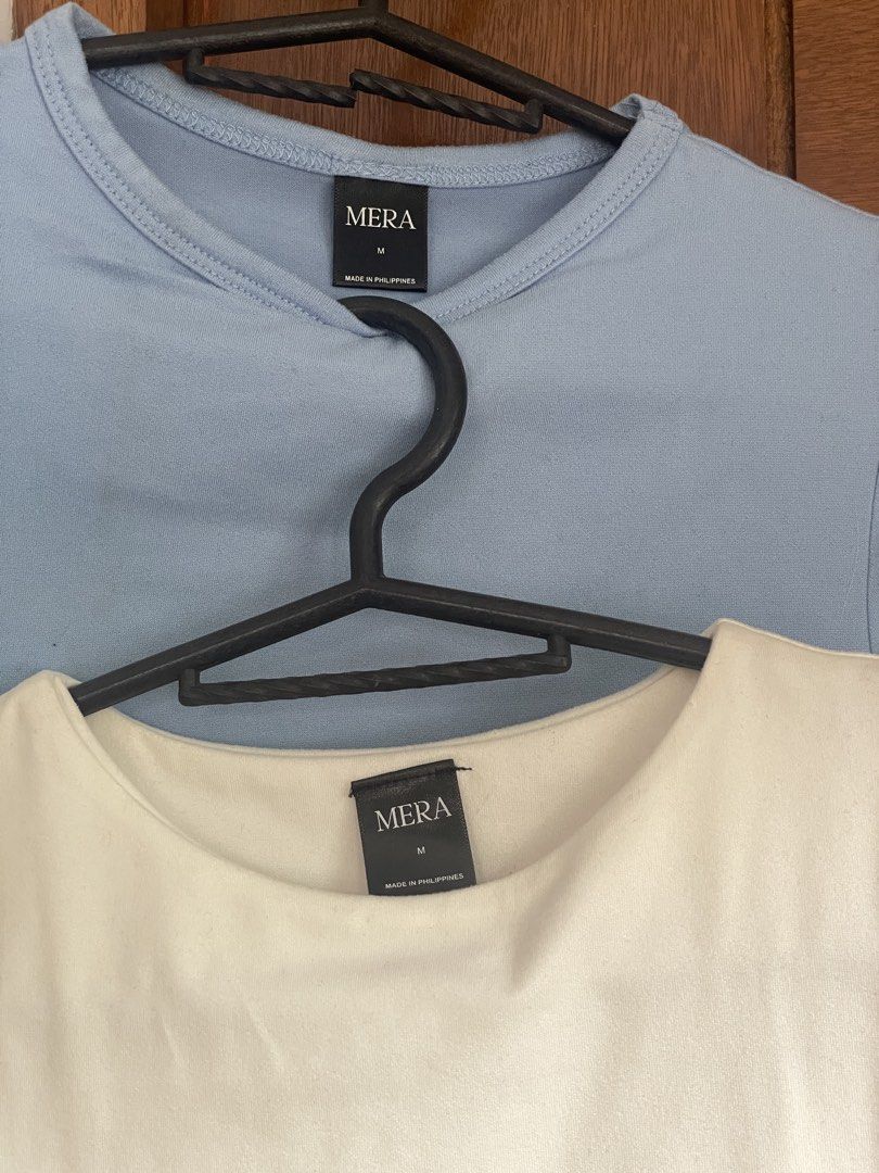 MERA Basic T-Shirt Bundle White and Blue Size M (Category: Shirts) located in Antipolo. Submitted by annagaskell (Listing ID 1467382595, Image 2). Description: ₱100 for both. Only worn once but they’ve been in my closet for over a year. Measurements available upon request. - Set of 2: White and Light Blue - Size: Medium - Fit: Fitted cut with short sleeves and round neckline - Versatile: Great for layering or wearing solo.