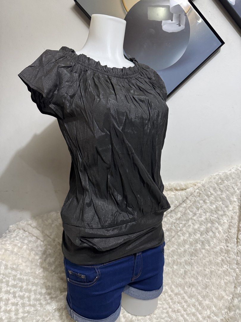 Metallic Gray Off-Shoulder Bubble Hem Blouse (Category: Blouses) located in Marikina City. Submitted by lorradel (Listing ID 1467514251, Image 2). Description: - fits M- semi L - Color & Finish: Dark gray metallic with subtle all-over shimmer - Design: Off-shoulder neckline with gathered ruffles and short cap sleeves - Fit: Relaxed drape with a cinched bubble hem and slight stretch - Styling: Great for a night out, easily paired with jeans or a s