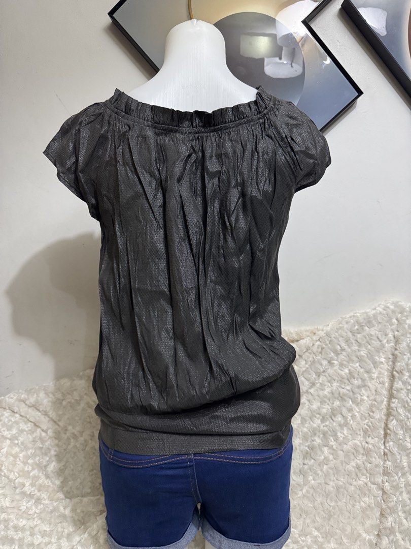 Metallic Gray Off-Shoulder Bubble Hem Blouse (Category: Blouses) located in Marikina City. Submitted by lorradel (Listing ID 1467514251, Image 3). Description: - fits M- semi L - Color & Finish: Dark gray metallic with subtle all-over shimmer - Design: Off-shoulder neckline with gathered ruffles and short cap sleeves - Fit: Relaxed drape with a cinched bubble hem and slight stretch - Styling: Great for a night out, easily paired with jeans or a s