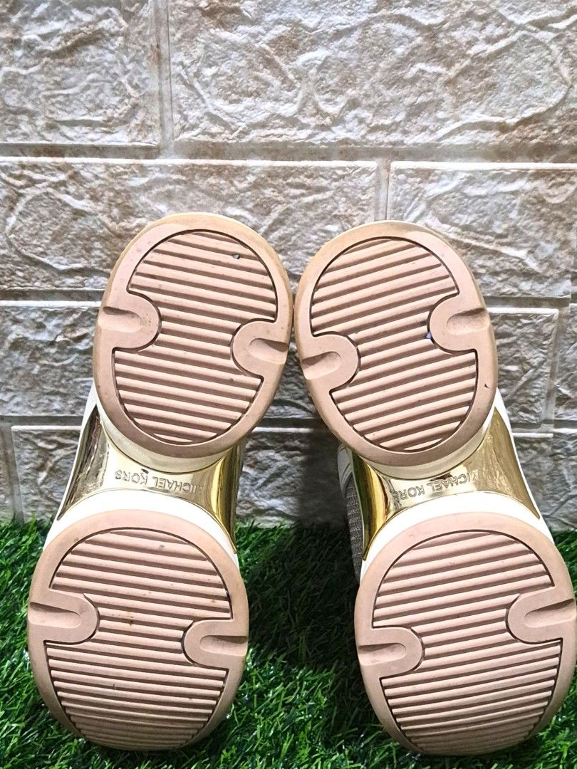 Michael Kors Glitter Chunky Sneakers Size: 5.5M (Category: Sneakers) located in Antipolo. Submitted by saribymonica (Listing ID 1460890195, Image 3). Description: - Michael Kors sneakers - Glittery mesh and white leather upper - Gold detailing - Pale pink lace-up closure - Comfortable chunky sole - Adds sparkle to any outfit - Minor signs of wear on soles and edges. Minimal color transfer. -- Authentic Michael Kors chunky sneakers - Chunky sole d
