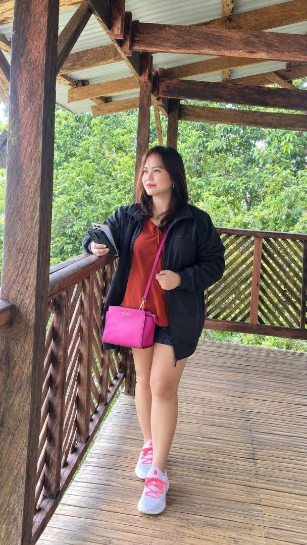 Michael Kors Pink Crossbody Bag (Category: Cross-body Bags) located in Manila. Submitted by talishang_ (Listing ID 1467602308, Image 3). Description: - Authentic Michael Kors crossbody bag in vibrant pink saffiano leather - Elegant gold-toned hardware and secure zip-top closure - Structured trapezoid shape with an adjustable shoulder strap - Compact yet spacious enough for your phone, keys, and small wallet - Super clean inside and out, ready to 