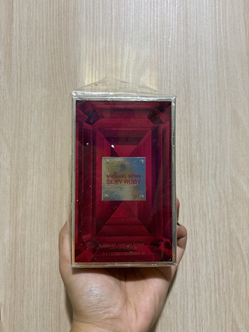 Michael Kors Sexy Ruby Eau de Parfum Spray 100ml (Category: Fragrance & Deodorants) located in Quezon City. Submitted by shopistas (Listing ID 1467387035, Image 1). Description: AUTHENTIC - Michael Kors Sexy Ruby Eau de Parfum - 100ml bottle - Brand new, still sealed in original box - Versatile scent suitable for any occasion Note: Plastic cover not intact From luxasis authenticity guarantee.