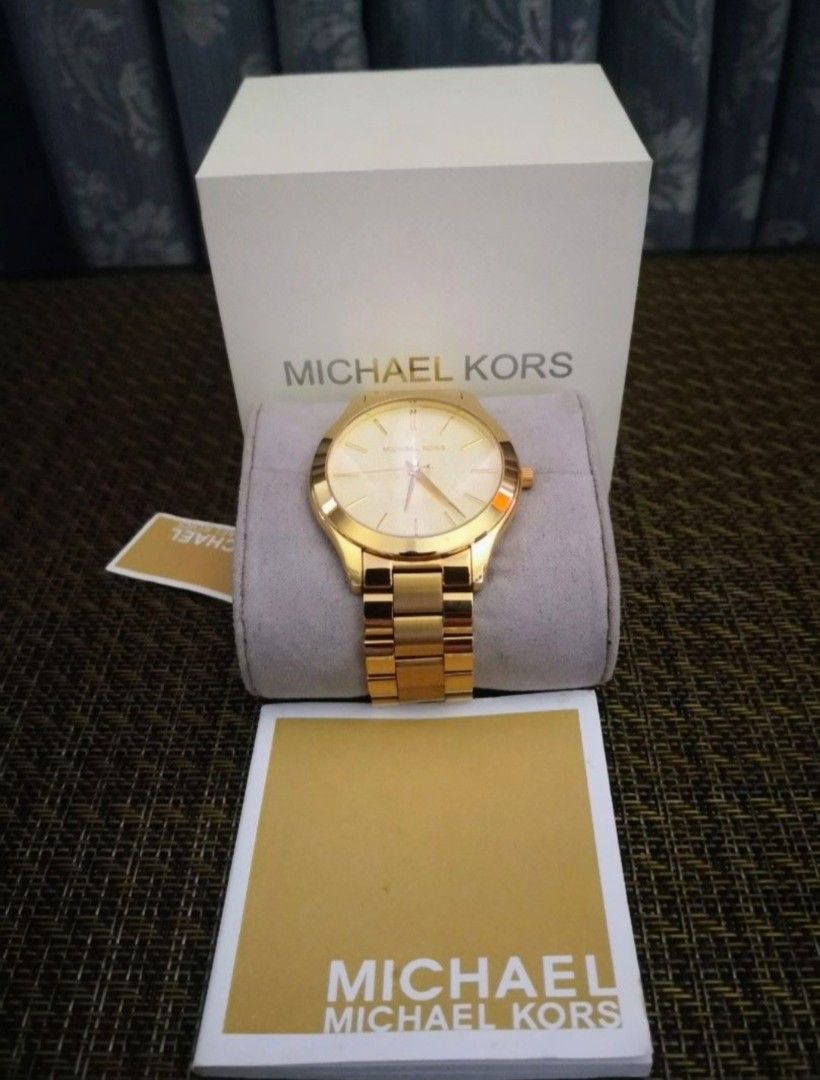 Michael Kors Slim Runway Watch (Category: Luxury Watches) located in Mandaluyong City. Submitted by ilovemyshop (Listing ID 1467401475, Image 1). Description: 💜 Perfect for everyday, the gold tone stainless Michael Kors Slim Runway three hand watch has a classic style. 💜 Case and dial round 42mm stainless steel case with a gold dial. 💜 Watch band gold stainless steel bracelet band, 30mm band width already adjusted to size 7 inches customized f