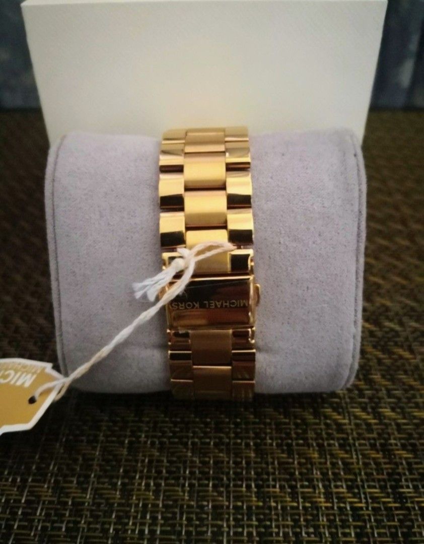 Michael Kors Slim Runway Watch (Category: Luxury Watches) located in Mandaluyong City. Submitted by ilovemyshop (Listing ID 1467401475, Image 3). Description: 💜 Perfect for everyday, the gold tone stainless Michael Kors Slim Runway three hand watch has a classic style. 💜 Case and dial round 42mm stainless steel case with a gold dial. 💜 Watch band gold stainless steel bracelet band, 30mm band width already adjusted to size 7 inches customized f
