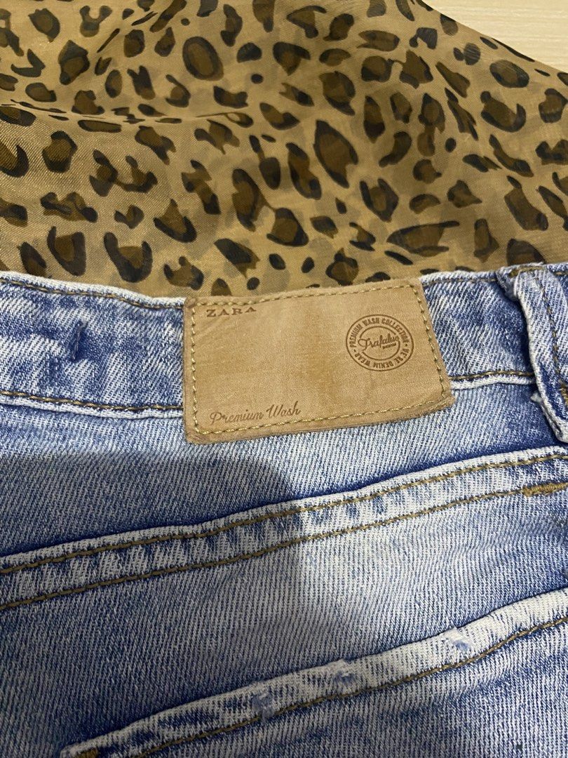 ZARA medium-wash distressed blue denim cutoff shorts (Category: Shorts) located in Manila. Submitted by lavernsloop (Listing ID 1467524359, Image 3). Description: size 29 | mid denim tattered | lenght 9 📩DM FOR MORE DEETS.