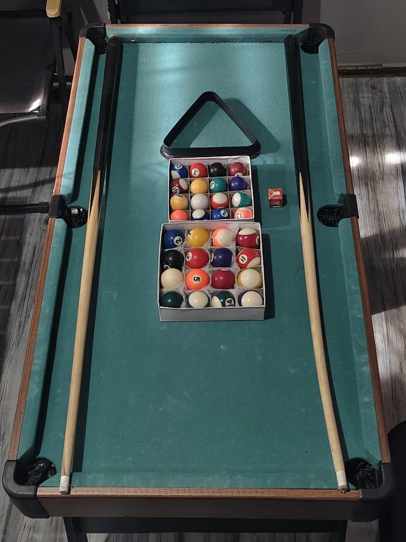 Mini Billiard (Category: Billiards and Bowling) located in Marikina City. Submitted by duaaaaa (Listing ID 1467476157, Image 1). Description: Mini billiard 🎱 95x50 cm Pwede pang business Pwede sa anak niyo para di na mangulit Inclusion 2 sets billiard ball 2 Cue stick (Medyo baliko na isa) 1 Tisa Rfs: Need space 2,500 Pick up or lalamove only. Location: Marikina city❗.