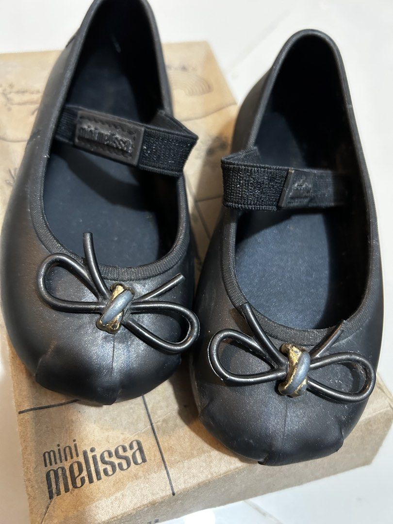 Mini Melissa Sophie BB US8 (Category: Babies & Kids Fashion) located in Antipolo. Submitted by mommytj (Listing ID 1467478320, Image 3). Description: - Brand: Mini Melissa Sophie BB - Color: Metallic Black - Size: USA 8 / EUR 24 / BRA 22 - Style: Classic slip-on Mary Jane with elastic strap and bow detail - Feature: Signature sweet bubblegum scent - Inclusion: Comes with original box .