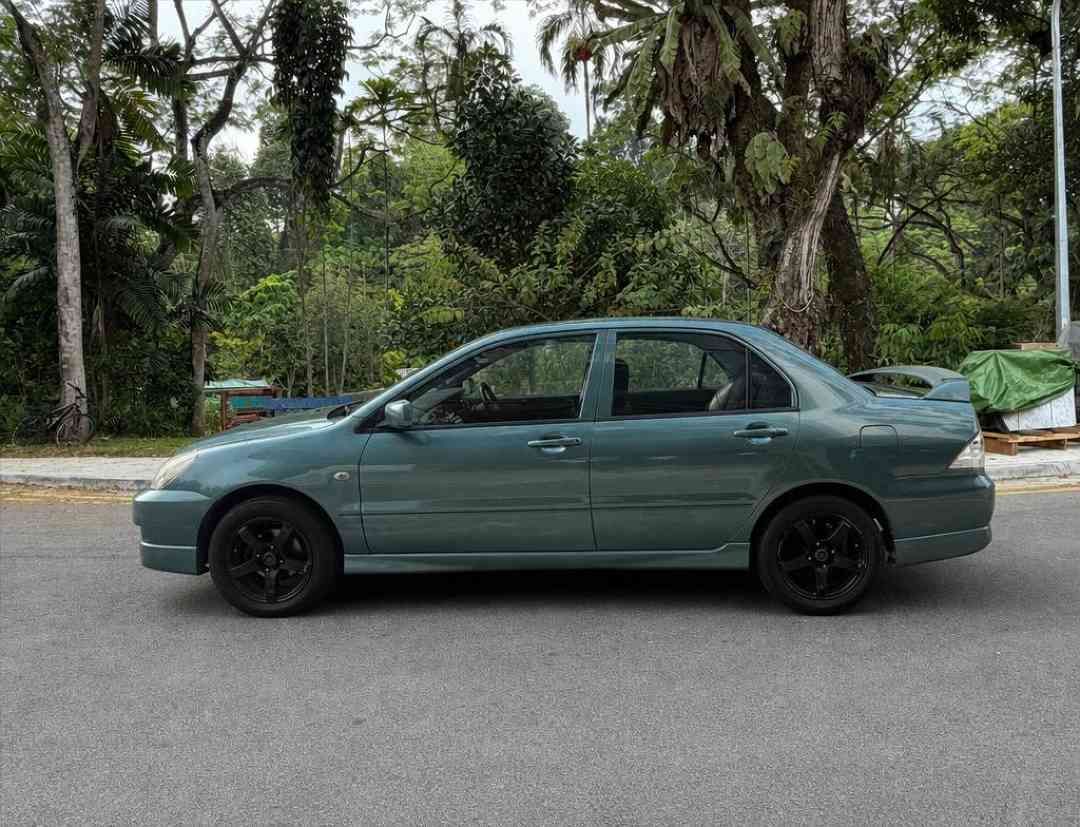Mitsubishi Lancer 1.6 GLX (M) (Category: Used Cars) located in Singapore. Submitted by carousell_certified_partners (Listing ID 1465503524, Image 2). Description: Good Condition! 100% Full Loan Available! 100% PHV Loan Available! Cheapest and Lowest Depreciation in The Market! 1 of Only 6 Dealers in Singapore to be Awarded Roll of Honor by SGCM! Buy With Confidence! In-House Loan or Bank Loan Available! Fast and Easy Loan Approval! Features: Powe