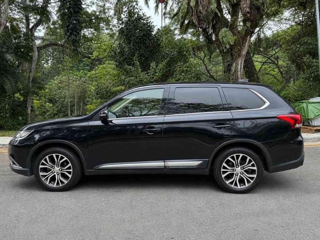 Mitsubishi Outlander 2.0 CVT Classic 7-Seater (A) (Category: Used Cars) located in Singapore. Submitted by carousell_certified_partners (Listing ID 1467533510, Image 2). Description: Still in its excellent original condition. 1 owner. Low mileage done. Stock condition. Highly sought after black on black color combi. Smooth drive despite its size. Surprisingly good fuel economy for a 7-seater SUV. View in person to be amazed. High loan & trade-in 