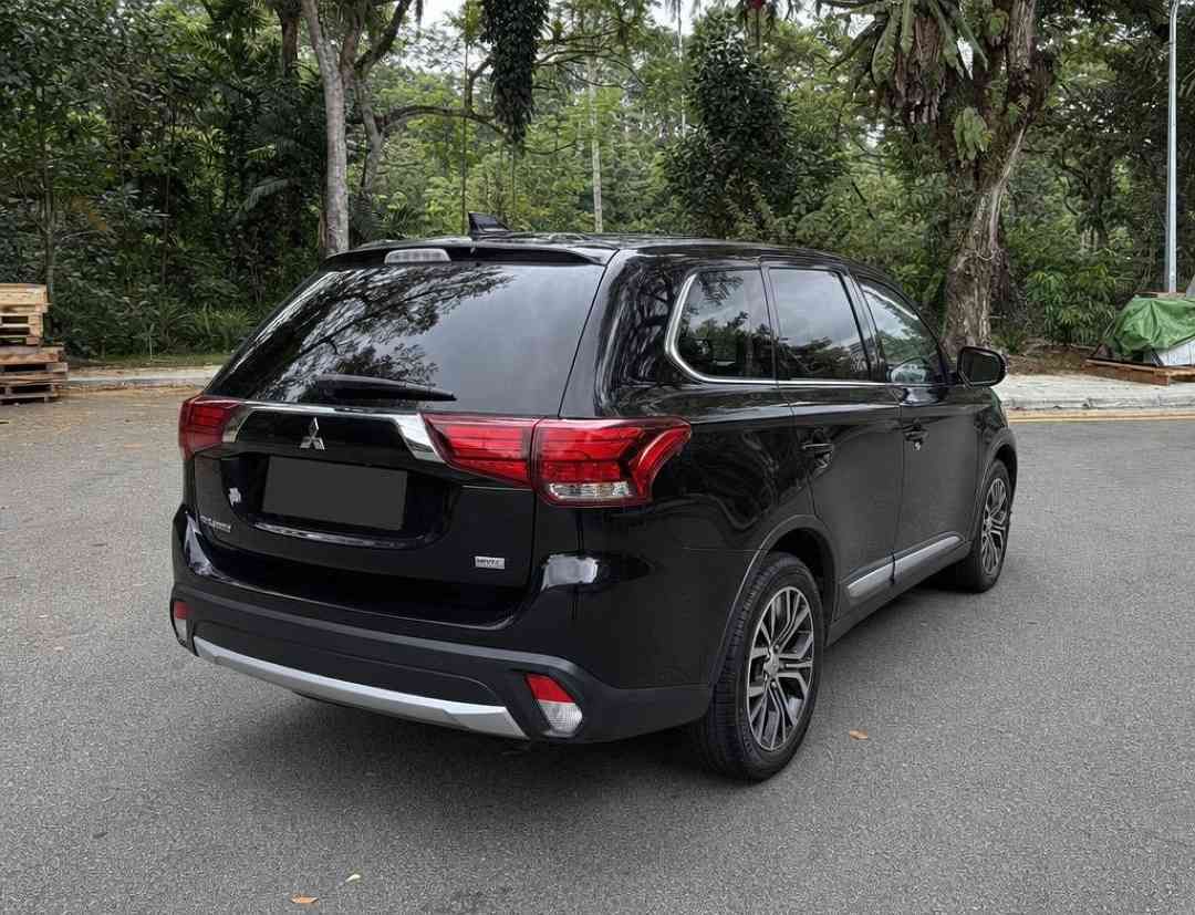 Mitsubishi Outlander 2.0 CVT Classic 7-Seater (A) (Category: Used Cars) located in Singapore. Submitted by carousell_certified_partners (Listing ID 1467533510, Image 3). Description: Still in its excellent original condition. 1 owner. Low mileage done. Stock condition. Highly sought after black on black color combi. Smooth drive despite its size. Surprisingly good fuel economy for a 7-seater SUV. View in person to be amazed. High loan & trade-in 