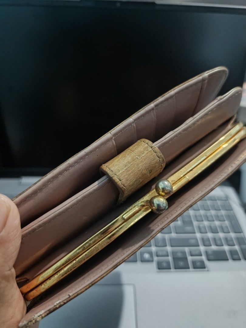 Miu Miu Crocodile Embossed Leather Wallet (Category: Wallets & Card holders) located in Pagsanjan. Submitted by enci25 (Listing ID 1467377747, Image 3). Description: - Brand: Miu Miu - Material: Tan crocodile-embossed leather with light pink interior lining - Hardware: Gold-tone metal lettering and accents - Compartments: Multiple card slots, cash compartments, and zippered coin pocket - Special Feature: Top kiss-lock coin purse section - Conditi