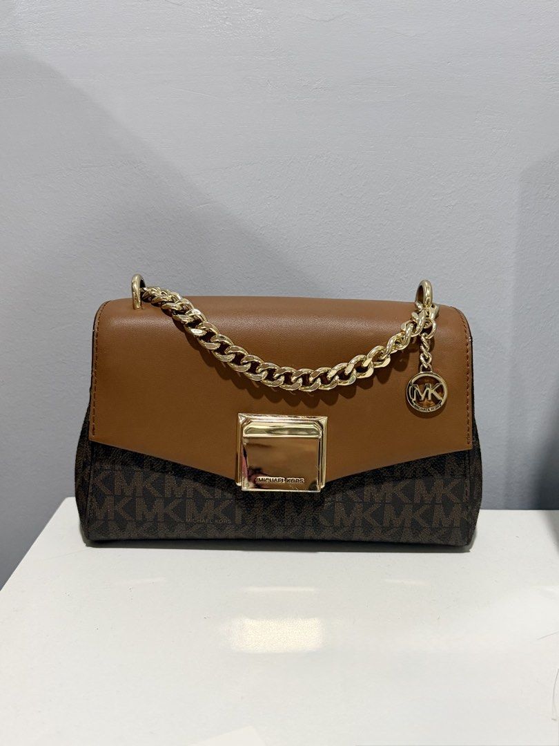 MK Michael Kors mini bag (Category: Luxury Bags & Wallets) located in Cebu City. Submitted by caseypie.cebuph (Listing ID 1467445471, Image 1). Description: (Preloved) Original bought in US Perfect for ocassion! This is crossbody bag please expect some minor sign of usage RFS: need to declutter DM for more details.