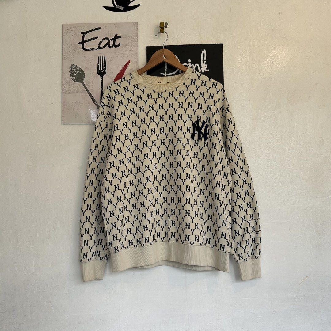 MLB New York Yankees Monogram Sweatshirt Off-White (Category: Coats, Jackets and Outerwear) located in Manila. Submitted by jakes_thrift_shop (Listing ID 1467510437, Image 1). Description: - Brand: MLB New York Yankees - Item: Monogram Sweatshirt - Color: Off-white with all-over navy monogram print - Size: L (tag attached) - Details: Embroidered team logo patch on chest, classic crewneck, ribbed collar, cuffs, and hem - Material: Comfortable heav