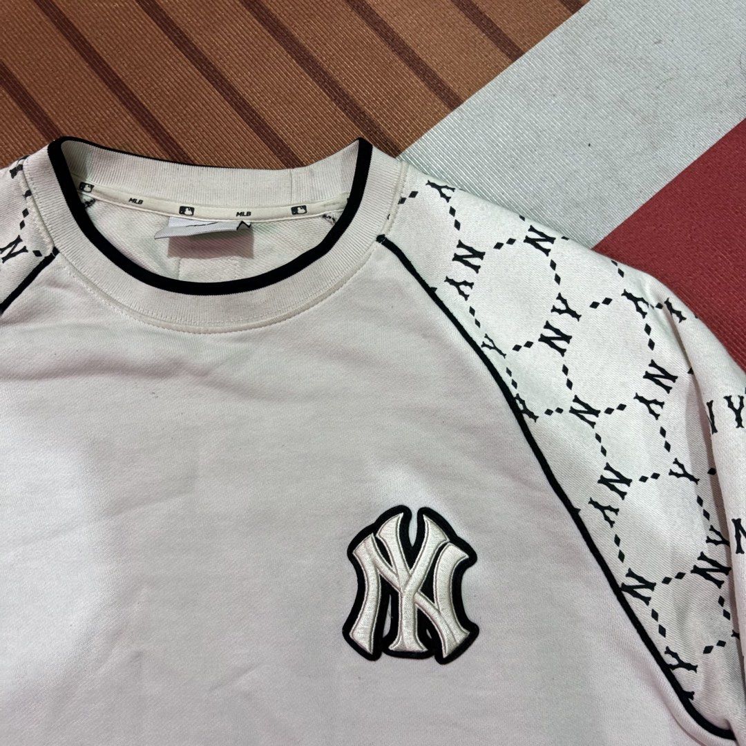 MLB New York Yankees NY Monogram White Sweatshirt (Category: Coats, Jackets and Outerwear) located in Manila. Submitted by carlmachu (Listing ID 1467495448, Image 2). Description: - Genuine MLB New York Yankees merchandise with official neck tag and hem label - Classic white crewneck design with contrasting black trim - Premium embroidered Yankees logo on the chest - Trendy sleeves featuring a repeating black NY geometric monogram pattern - Comfo