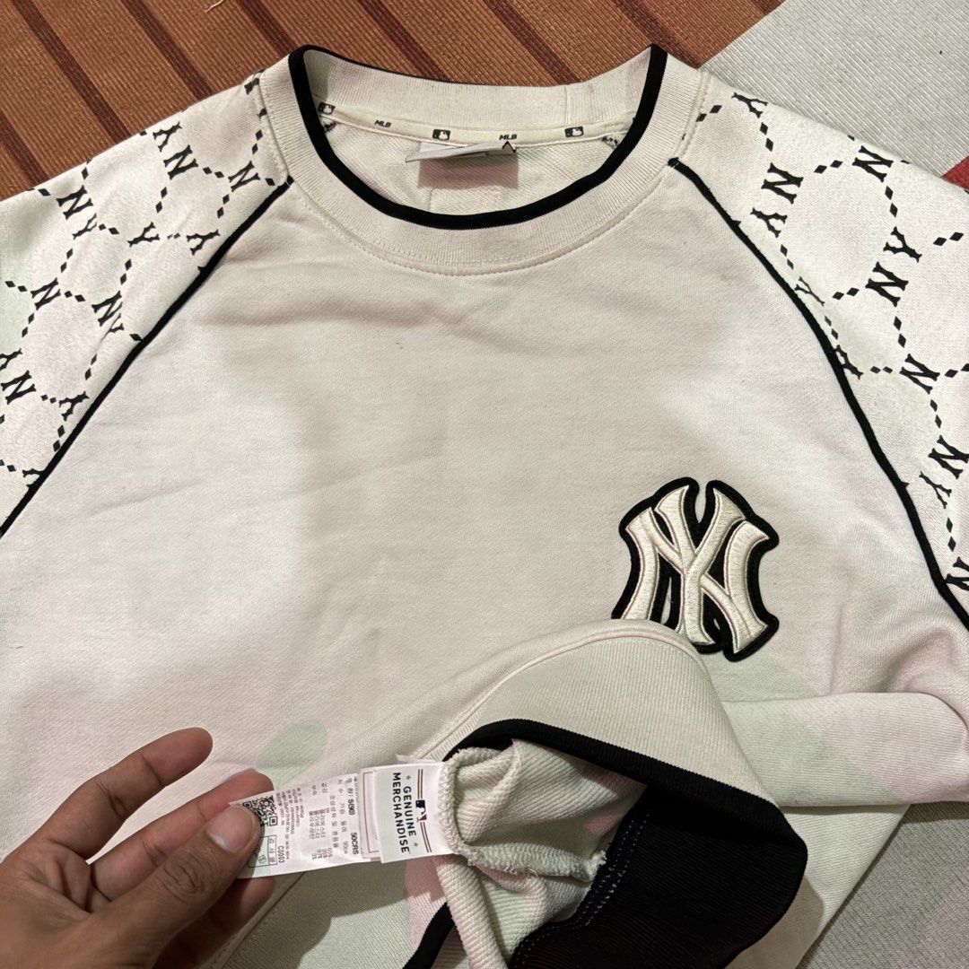 MLB New York Yankees NY Monogram White Sweatshirt (Category: Coats, Jackets and Outerwear) located in Manila. Submitted by carlmachu (Listing ID 1467495448, Image 3). Description: - Genuine MLB New York Yankees merchandise with official neck tag and hem label - Classic white crewneck design with contrasting black trim - Premium embroidered Yankees logo on the chest - Trendy sleeves featuring a repeating black NY geometric monogram pattern - Comfo