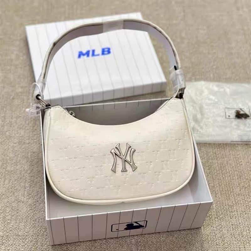MLB NY Yankees Monogram Leather Hobo Bag (Category: Shoulder Bags) located in Quezon City. Submitted by stuffs.hellyy (Listing ID 1467549958, Image 2). Description: with box.