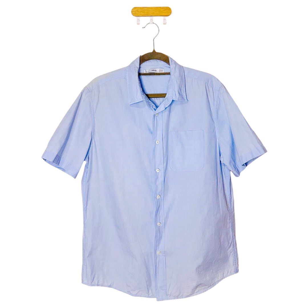 MNG Light Blue Short Sleeve Button-Up Shirt (Category: Coats, Jackets and Outerwear) located in Pasay City. Submitted by el.sole (Listing ID 1467534087, Image 1). Description: - Brand: MNG - Color: Light blue - Sleeve: Short sleeve - Details: Button-down front, standard collar, single left chest pocket - Fit: Standard fit - Fabric: Lightweight, ideal for warm weather - Styling: Perfect for pairing with jeans or chinos Please manage your expectati