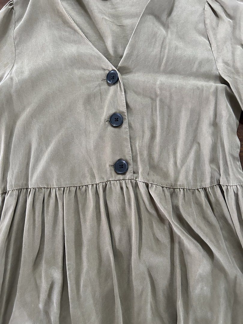 MNG Olive Green Button-Front Tiered Dress (Category: Dresses) located in Muntinlupa City. Submitted by manikascloset (Listing ID 1467395337, Image 2). Description: - Brand: MNG (Mango) - Size: Medium (EUR M / USA 6) - Color: Olive Green - Design: V-neckline with 3 dark front buttons, short puff sleeves, layered tiered skirt - Material: Lightweight fabric with a soft finish - Condition: great / Pre-loved - Mode of Payment: BPI/Metrobank - Shipping