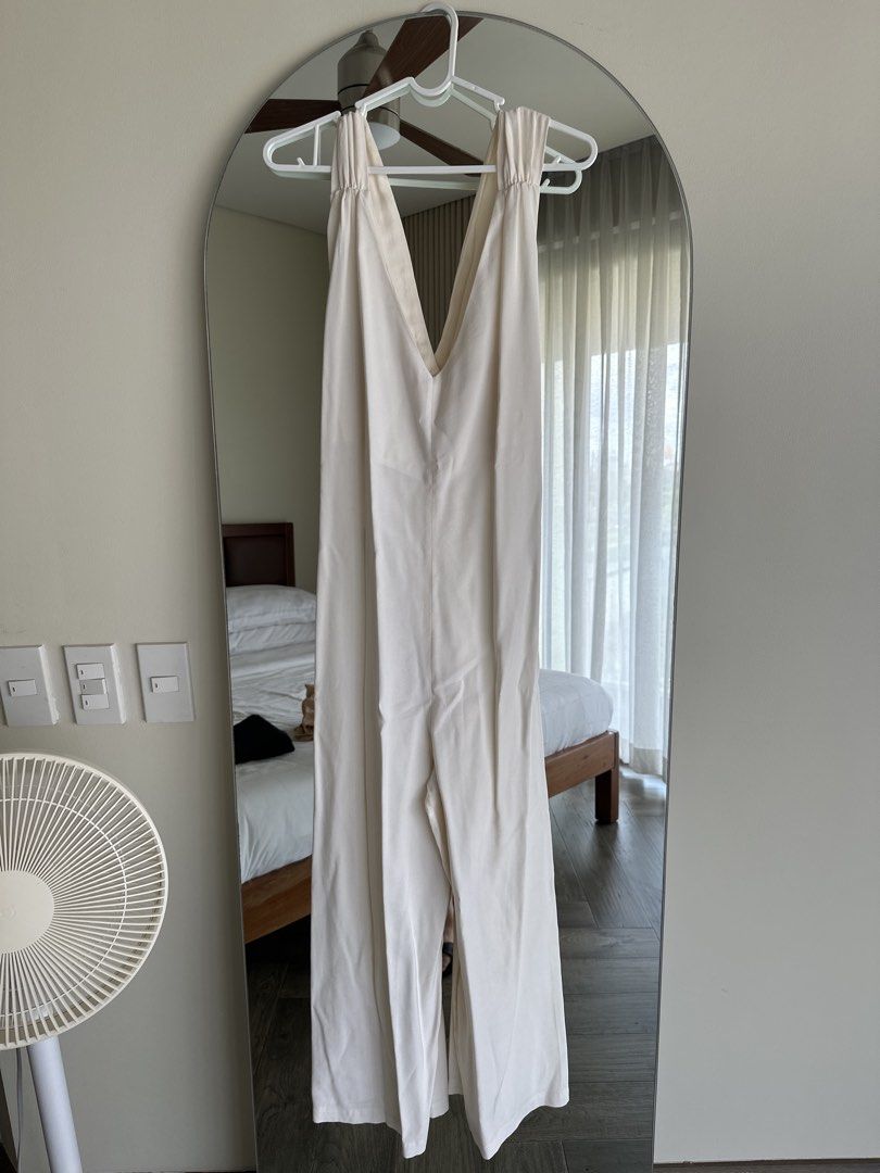 MNG White Jumpsuit Size M (Category: Jumpsuits) located in Taguig. Submitted by anarinamizu (Listing ID 1467425734, Image 1). Description: - Brand: MNG - Size: EUR M / USA M / MEX M - Color: White - Design: Deep V-neck, pleated wide-leg pants, gathered shoulder/strap details - Origin: Made in China - Versatility: Great for casual wear or dressing up.