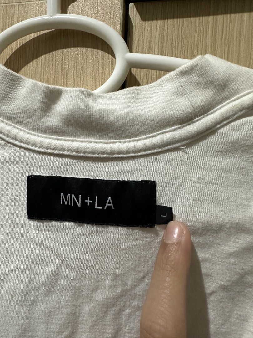 MN+LA White Tee Size L (Category: Tshirts & Polo Shirts ) located in Mandaluyong City. Submitted by _s3ll3r (Listing ID 1467455334, Image 1). Description: - Brand: MN+LA - Color: Classic White - Size: Large (L) - Style: Crew neck basic tee with stylish exposed seam details on shoulders and sides - Fit: Comfortable and great for daily wear - Condition: Excellent / Ready to ship - Mode of Payment: GCash or bank transfer - Shipping: Via J&T Express 