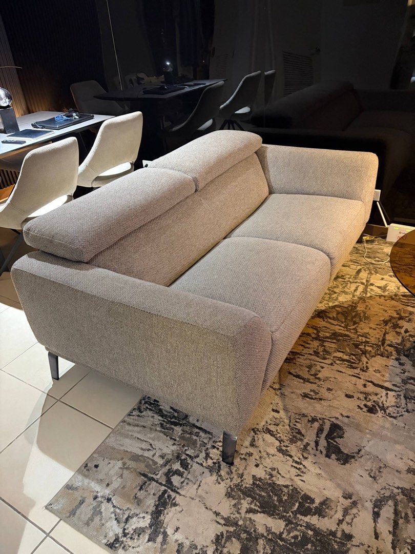 Modern Grey Fabric 2-Seater Sofa with Adjustable Headrests (Category: Sofas) located in Manila. Submitted by iammaleficent18 (Listing ID 1467511174, Image 1). Description: - Style: Modern 2-seater loveseat with clean lines - Material: Premium textured grey fabric - Legs: Sleek dark finish metal legs - Comfort: Features two adjustable back cushions and solid armrests - Versatile: Ideal for living rooms, condo units, or office spaces - Dimensions: 
