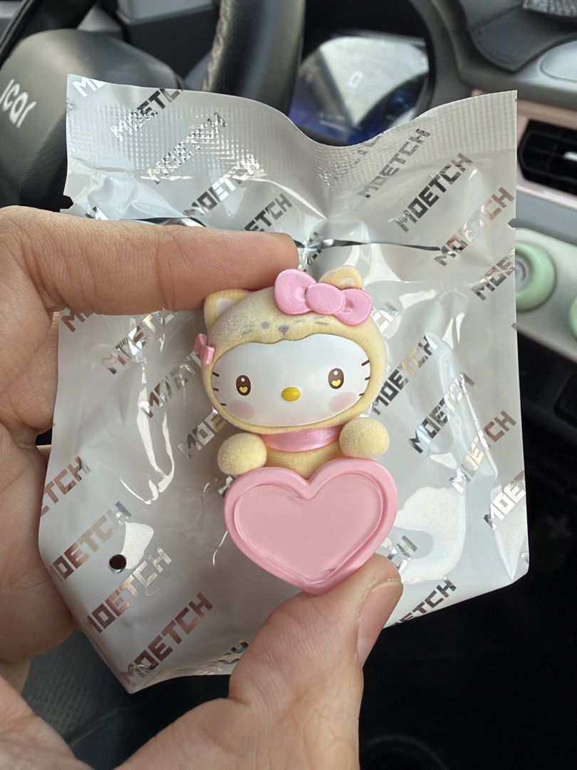 Moetch Hello Kitty Fuzzy Figure Hipper (Category: Character Goods) located in Imus. Submitted by yummyfinds (Listing ID 1467469447, Image 1). Description: - Brand: Moetch Kitty figure - Design: Fuzzy yellow texture holding a pink heart with a pink bow and ribbon on the back - Condition: Mint, never displayed or used - Packaging: Opened only to check the character.