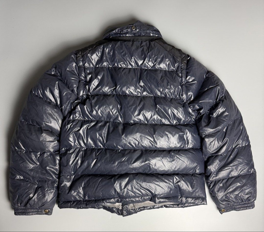Moncler Kids Andersen Puffer Down Jacket Navy Blue (Category: Kids Wardrobes & Storage) located in Manila. Submitted by limsanity03 (Listing ID 1467524851, Image 2). Description: - Moncler puffer jacket in navy blue - Contrasting dark shoulder panel and silver hardware - Signature felt logo patch on the left chest - Branded zipper pulls and engraved snap buttons - Issue Missing Hood actual dimes width 28 length 22 shoulder to Shoulder 14.5 sleeve