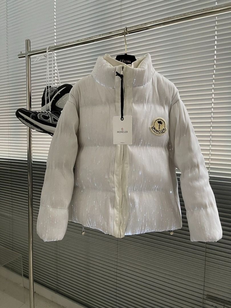 Moncler x Palm Angels LED Light Up Puffer Jacket (Category: Coats, Jackets and Outerwear) located in Pateros City. Submitted by keenriver2de (Listing ID 1467468133, Image 2). Description: - Brand: Moncler x Palm Angels Collaboration - Color: White with embedded glowing fiber optic lights - Details: Moncler chest badge, bold Palm Angels back lettering - Design: Stand-up collar, front zip closure - Condition: Brand new with hang tag still attached.