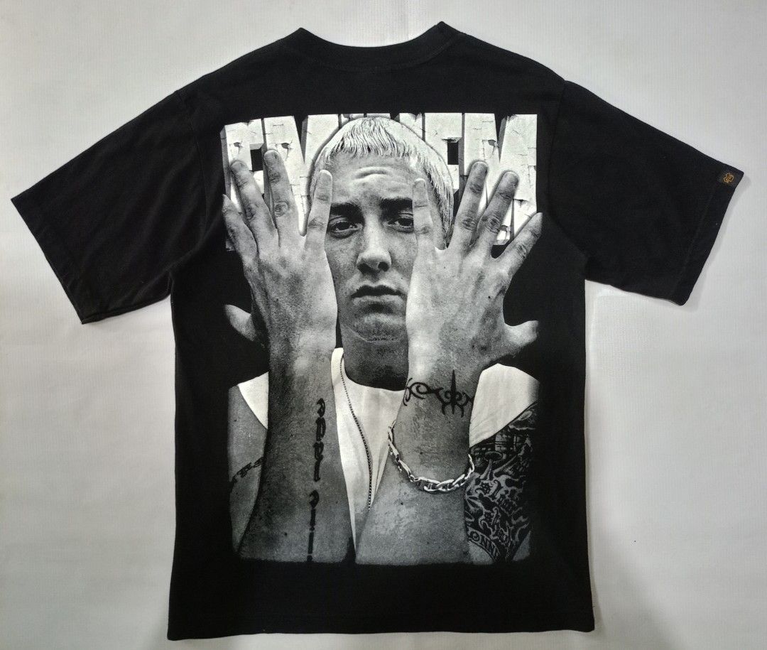 Mr. Tees Eminem Graphic Tee Black Size M (Category: Tshirts & Polo Shirts ) located in Caloocan City. Submitted by grandturtle-371b8d (Listing ID 1467397331, Image 2). Description: - Brand: Mr. Tees - Design: Eminem graphic print on front and back - Color: Black - Size: M - Material: 100% Cotton (Made in Thailand) - Care Instructions: Hand wash only, do not bleach, do not iron.