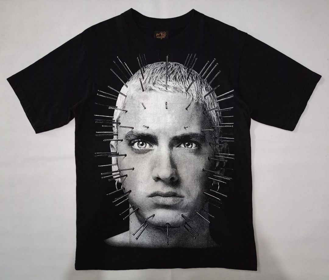 Mr. Tees Eminem Graphic Tee Black Size M (Category: Tshirts & Polo Shirts ) located in Caloocan City. Submitted by grandturtle-371b8d (Listing ID 1467397331, Image 1). Description: - Brand: Mr. Tees - Design: Eminem graphic print on front and back - Color: Black - Size: M - Material: 100% Cotton (Made in Thailand) - Care Instructions: Hand wash only, do not bleach, do not iron.