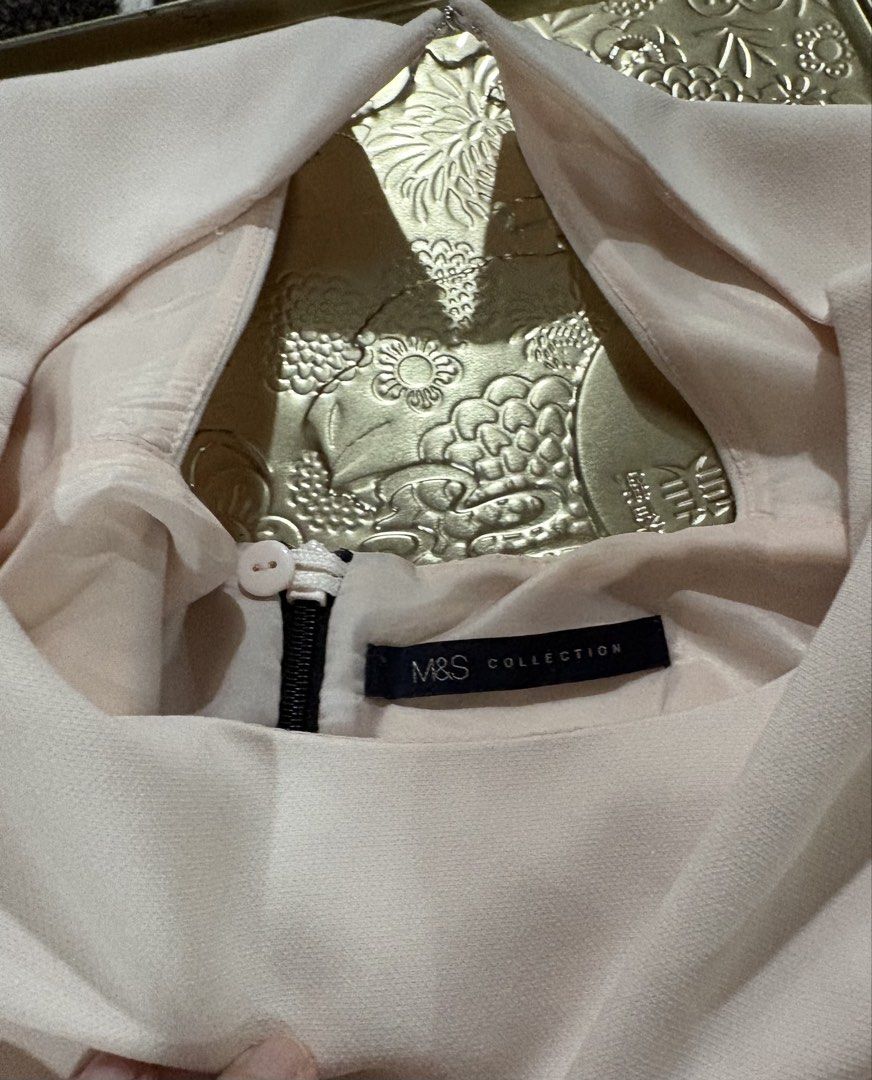 M&S Collection Two-Tone Colour Block Dress (Category: Dresses) located in Cavite. Submitted by momskiette (Listing ID 1467542496, Image 3). Description: - Brand: M&S Collection - Design: Cream top with a black pencil skirt bottom - Fit: Structured bodycon, knee-length - Details: Short sleeves, round neckline, and classy back cutout with zipper closure - Style: Classic office wear or elegant dinner outfit, easy to pair with heels Fits Small to Med