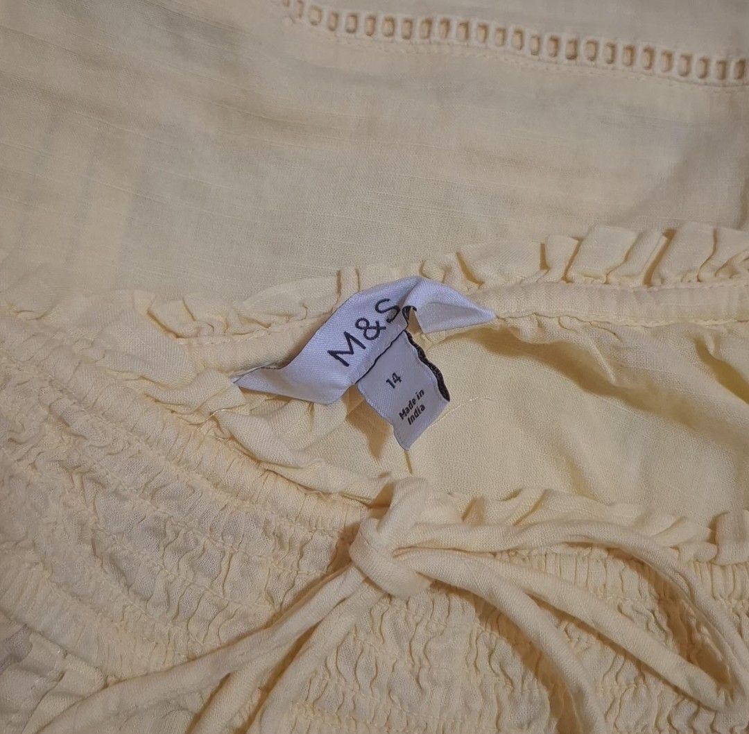 Marks & Spencer Lace Boho Peasant Blouse (Yellow) - Worn Once (Category: Blouses) located in Quezon City. Submitted by MP_Declutters (Listing ID 1467429122, Image 2). Description: Description: ✨ M&S Pastel Yellow Boho-Chic Blouse ✨ Brand: Marks & Spencer (M&S) Size: UK 14 / EU 42 (Fits Medium to Large comfortably due to the relaxed cut) Color: Pastel Butter Yellow Style: Peasant/boho style with a gathered scoop neck, front tie detail, vertical cr