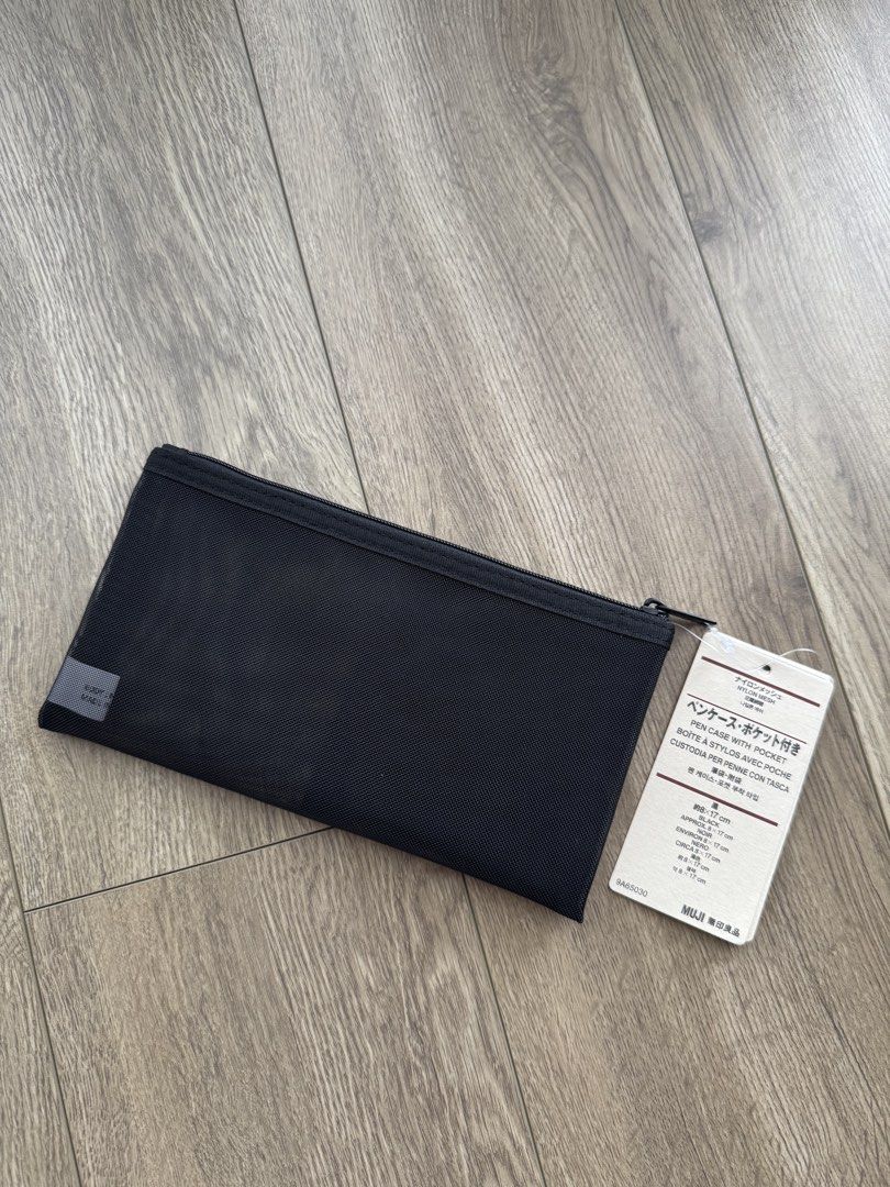 MUJI Nylon Mesh Pen Case with Pocket Black (Category: Stationery & School Supplies) located in Davao. Submitted by Tineeee. (Listing ID 1467371964, Image 1). Description: - Brand: MUJI - Material: Durable black nylon mesh - Condition: Brand new with original store tags - Features: Secure zip closure and convenient built-in pocket - Size: Approximately 17 cm - Perfect for: Organizing stationery, pens, or small everyday accessories.