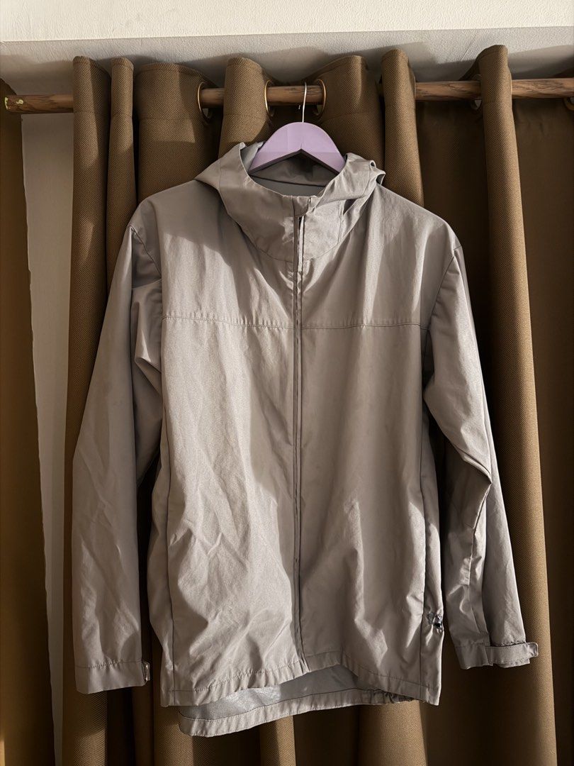 MUJI Raincoat Jacket (Category: Coats, Jackets and Outerwear) located in Makati City. Submitted by florencedoll (Listing ID 1467535746, Image 1). Description: DISCLAIMER: This jacket has a burn on the side, that is why it is selling for low. Purchased this for 2300 up - Color: Grey - Style: Hooded jacket / windbreaker - Closure: Full front zipper - Features: Lightweight material, long sleeves, adjustable cuffs, and chest seam - Convenience: Easy 