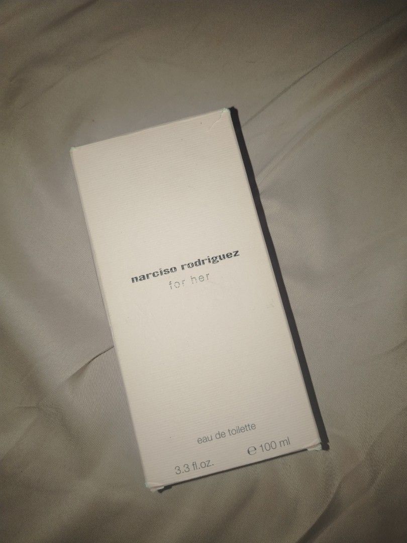 Narciso Rodriguez For Her Eau De Toilette 100ml (Category: Fragrance & Deodorants) located in Manila. Submitted by warmwater.788864 (Listing ID 1467411344, Image 2). Description: - Brand: Narciso Rodriguez - Fragrance: For Her Eau de Toilette (EDT) - Size: 100ml bottle - Condition: Brand new, full, and unused - Packaging: Original box included (note: box has minor edge wear from storage) - Scent Profile: Classic floral and musky notes.