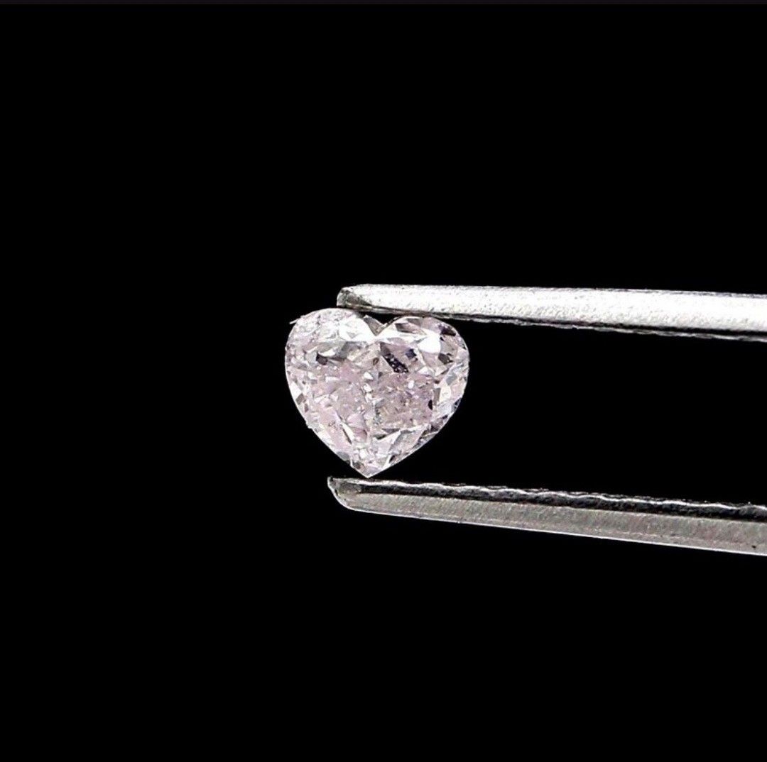Natural diamond (Category: Luxury Accessories) located in Goa. Submitted by brilyo (Listing ID 1467387307, Image 1). Description: *Natural diamond *carat: 0.20 *cut: heart *color: fancy light pink/ purplish pink *clarity: VS1 please inquire for more details. Thank you!.